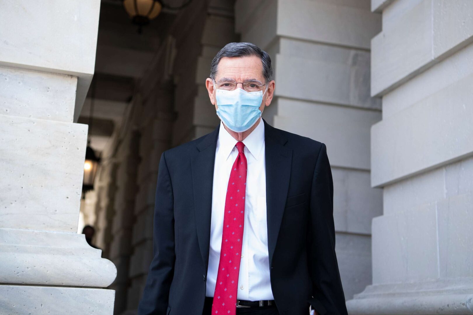 Sen. John Barrasso, R-Wyo., is seen in the Senate carriage of the Capitol during a vote on March 11, 2021. 
