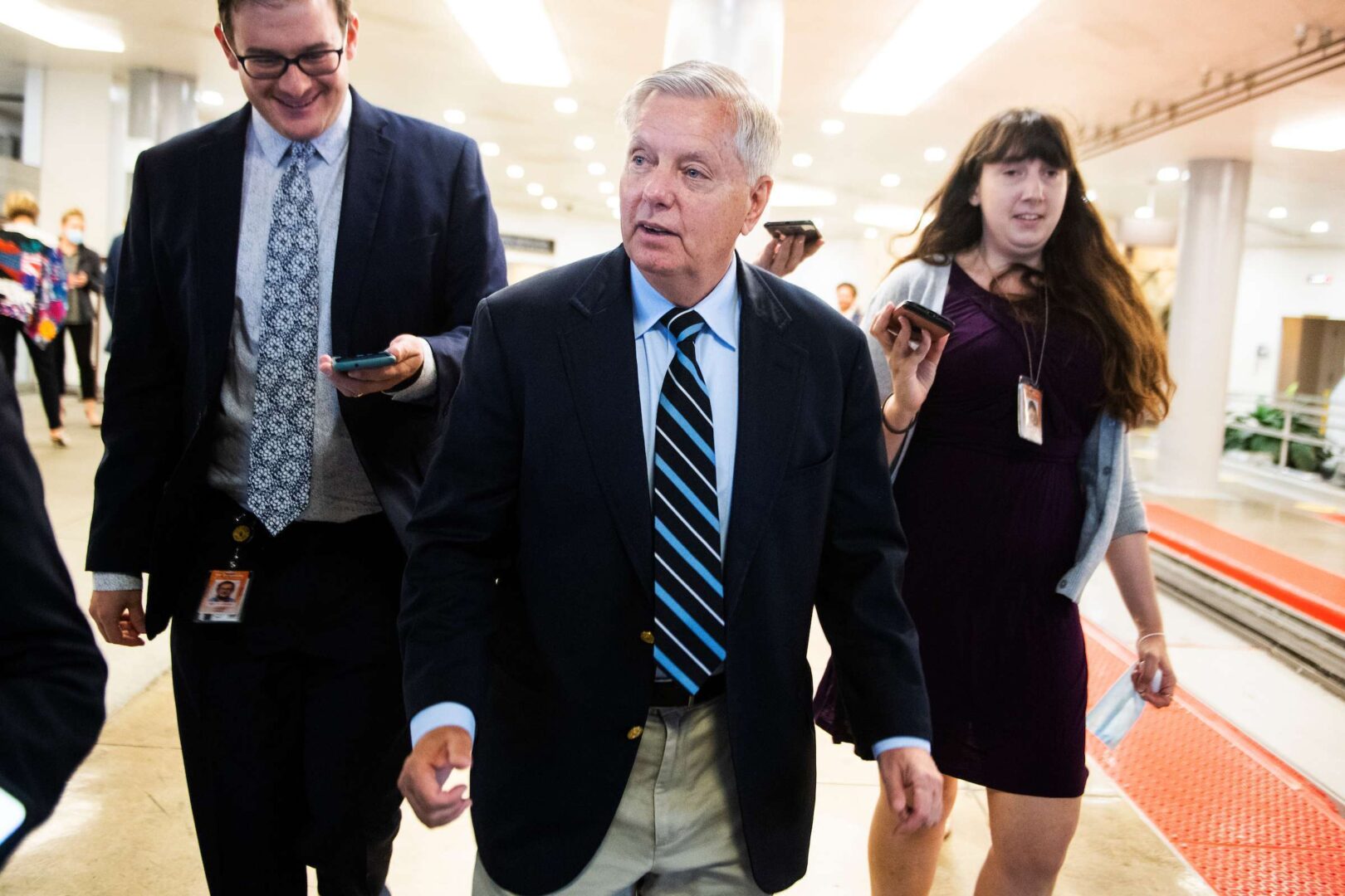 Sen. Lindsey Graham, R-S.C.,  talks with reporters in the Senate subway during a vote on Wednesday, May 19, 2021. 