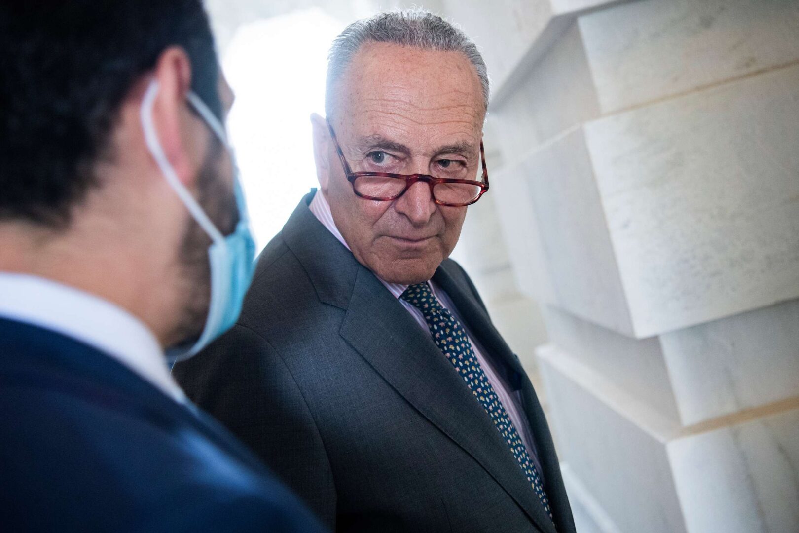 Senate Majority Leader Charles Schumer, D-N.Y., pictured making his way to a news conference outside the Capitol, had set Wednesday as a deadline for his caucus to agree on moving forward with a budget resolution to begin the process on a $3.5 trillion reconciliation package.