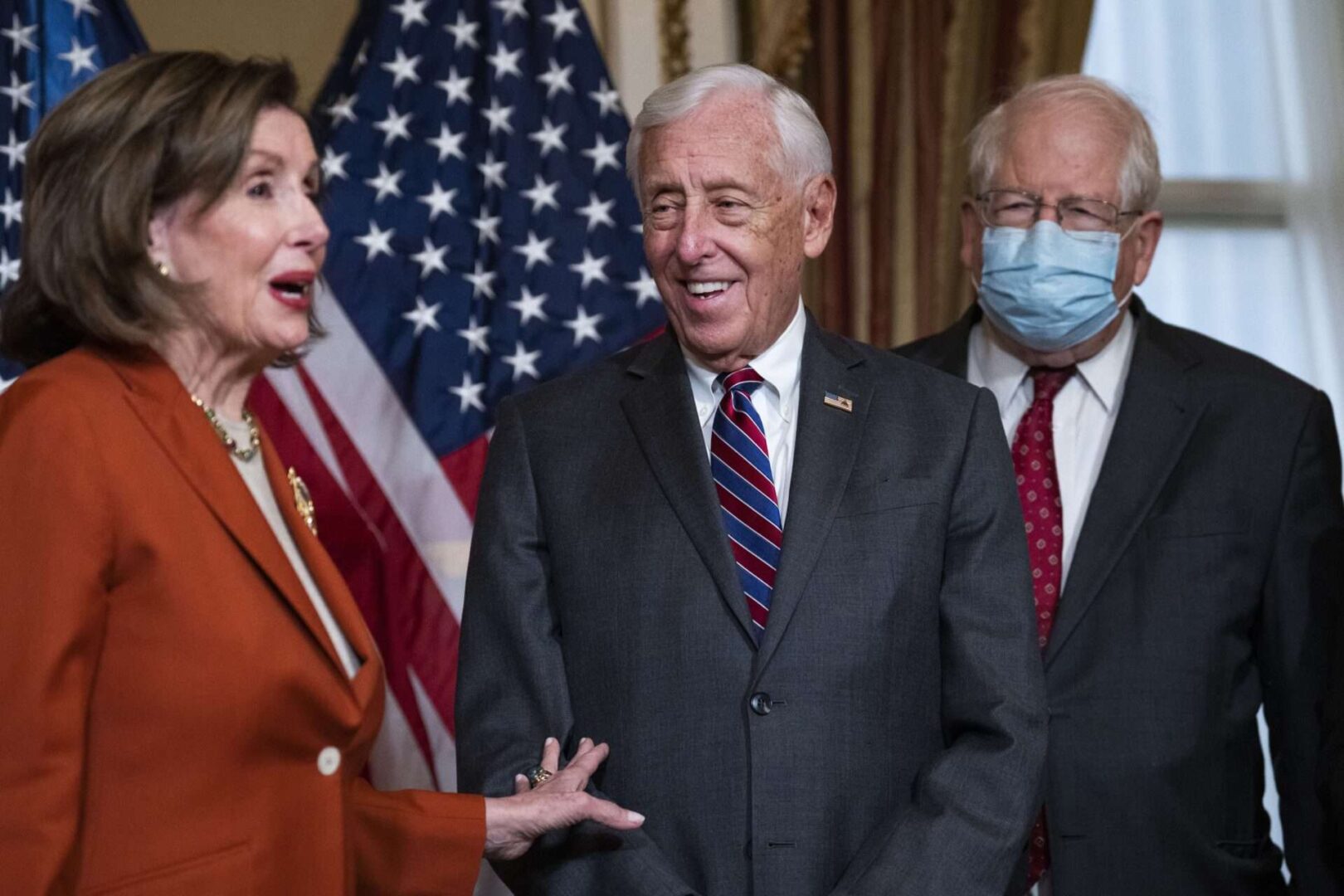 Speaker Nancy Pelosi, D-Calif., House Majority Leader Steny H. Hoyer, D-Md., and Rep. David E. Price, D-N.C., right, conduct a bill enrollment ceremony for the stopgap spending bill in the Capitol.