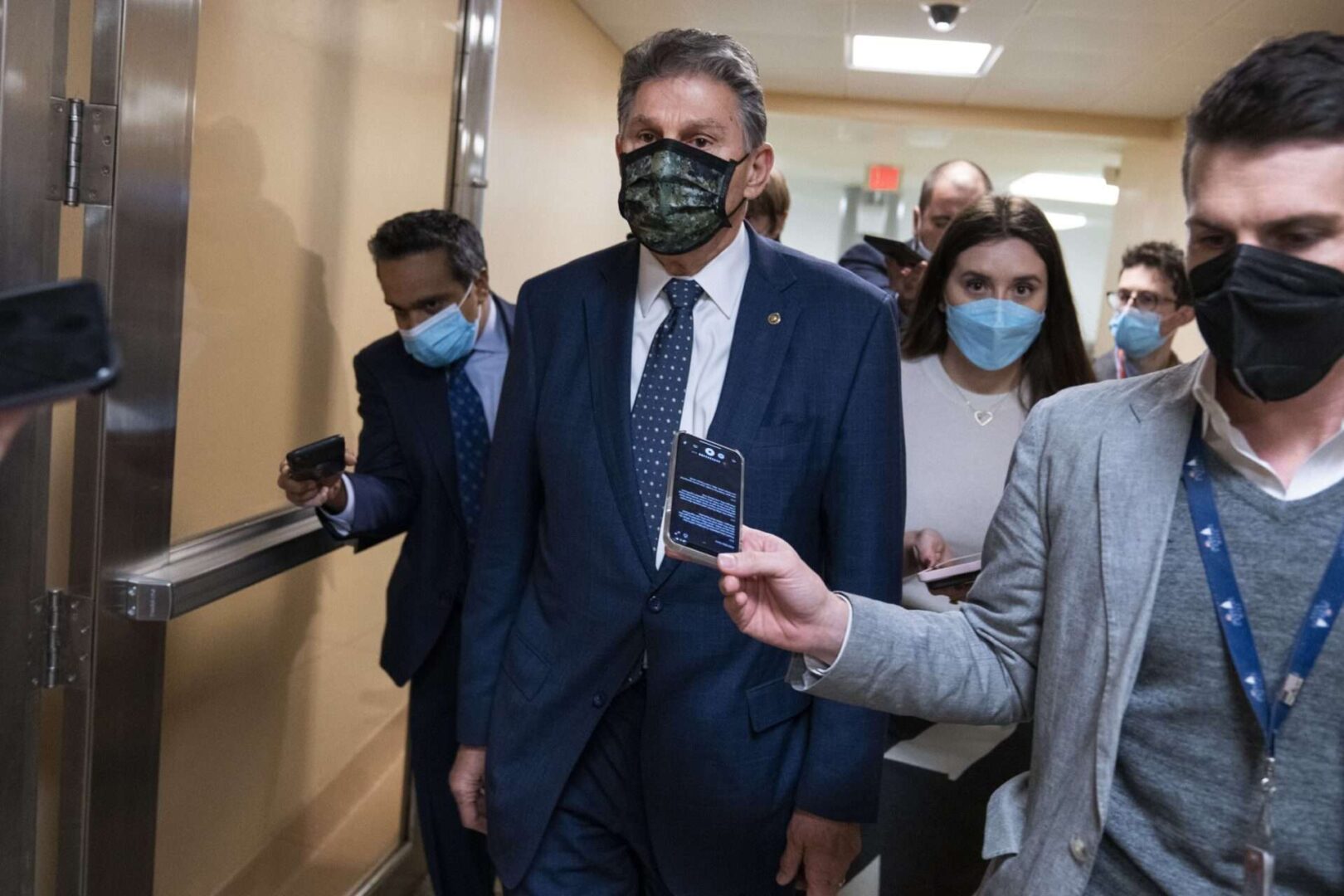 Sen. Joe Manchin III, D-W.Va., makes his way to a Senate Democrats' luncheon in the Capitol on Thursday.