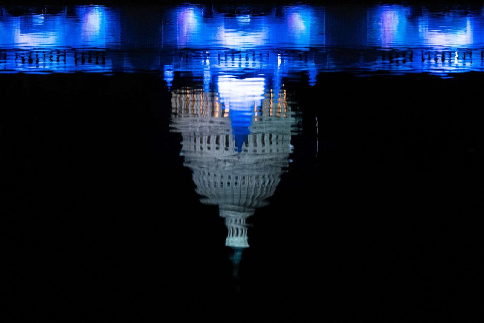 The Capitol dome reflects in the Lower Senate Park reflecting pool on May 15.