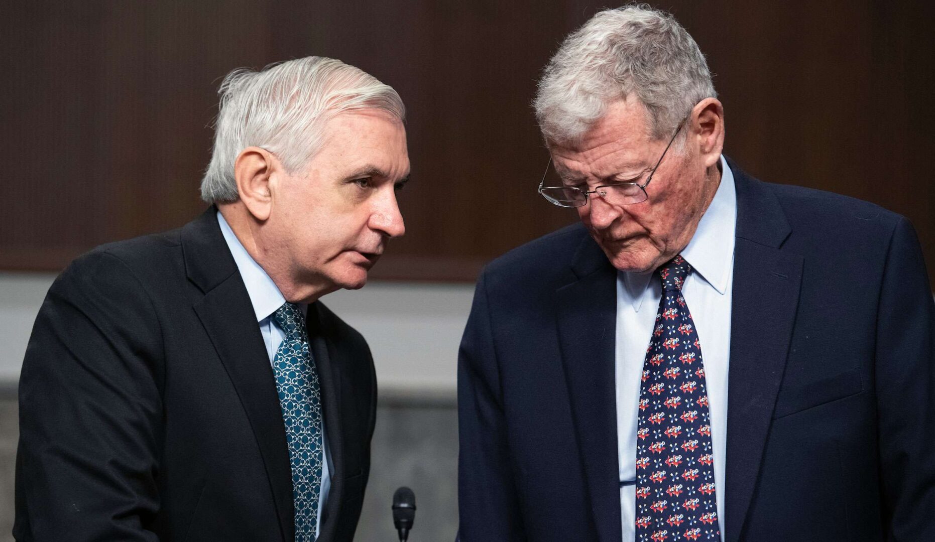 Chairman Jack Reed, left, and ranking member Sen. James M. Inhofe are seen at a Senate Armed Services Committee hearing in 2021. Disputes in the panel over defense spending could stall appropriations. 