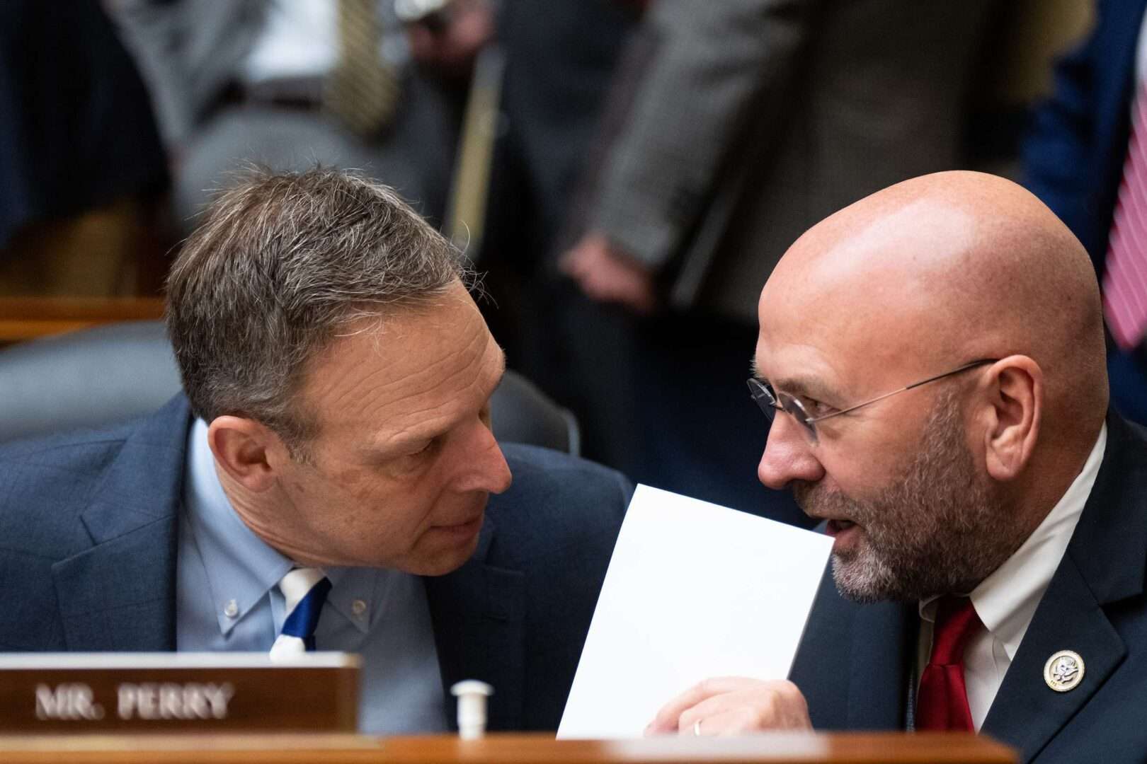 Rep. Scott Perry, R-Pa., left, and Rep. Clay Higgins, R-La., talk during a House Oversight and Accountability Committee meeting  on Jan. 31.