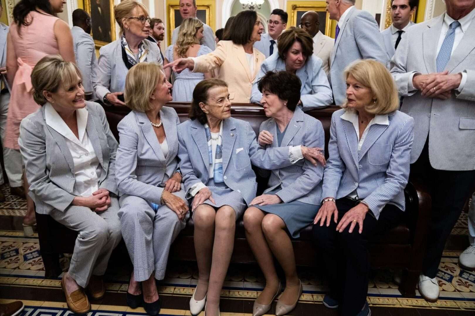 From left, Sens. Cindy Hyde-Smith, R-Miss., Shelley Moore Capito, R-W.Va., Dianne Feinstein, D-Calif., Susan Collins, R-Maine, and Lisa Murkowski, R-Alaska, pose for a picture to mark National Seersucker Day in the Capitol on June 8.