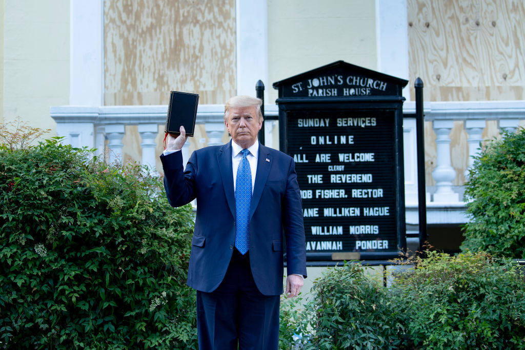 President Donald Trump holds a Bible upside down while visiting St. John's Church across from the White House during protests in Washington on June 1, 2020.