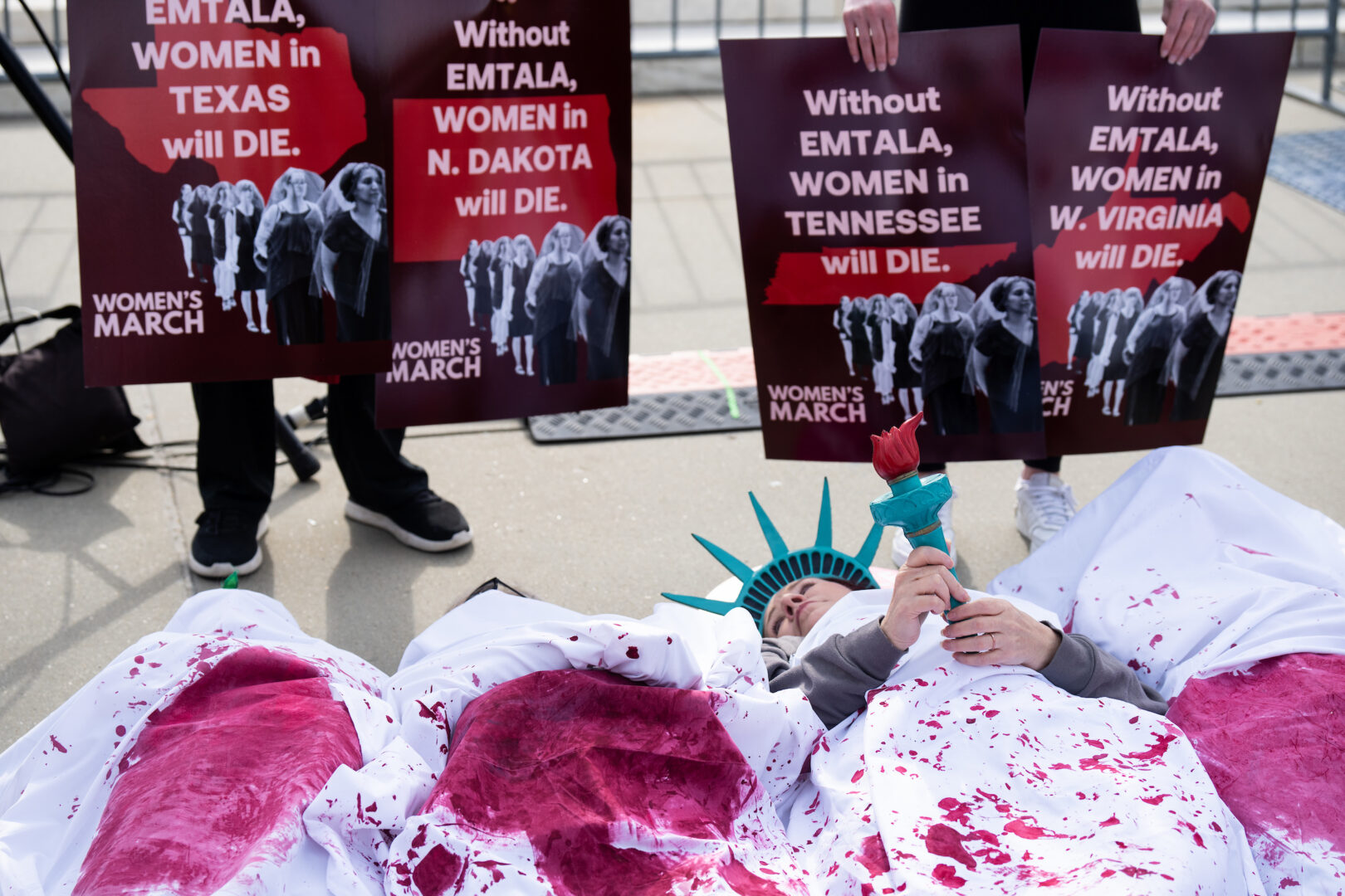 Women’s March holds a die-in outside the U.S. Supreme Court before oral arguments in Moyle v. United States on Wednesday. The case challenges a federal law that requires hospitals to perform an emergency abortion when needed to resolve a patient’s medical emergency.