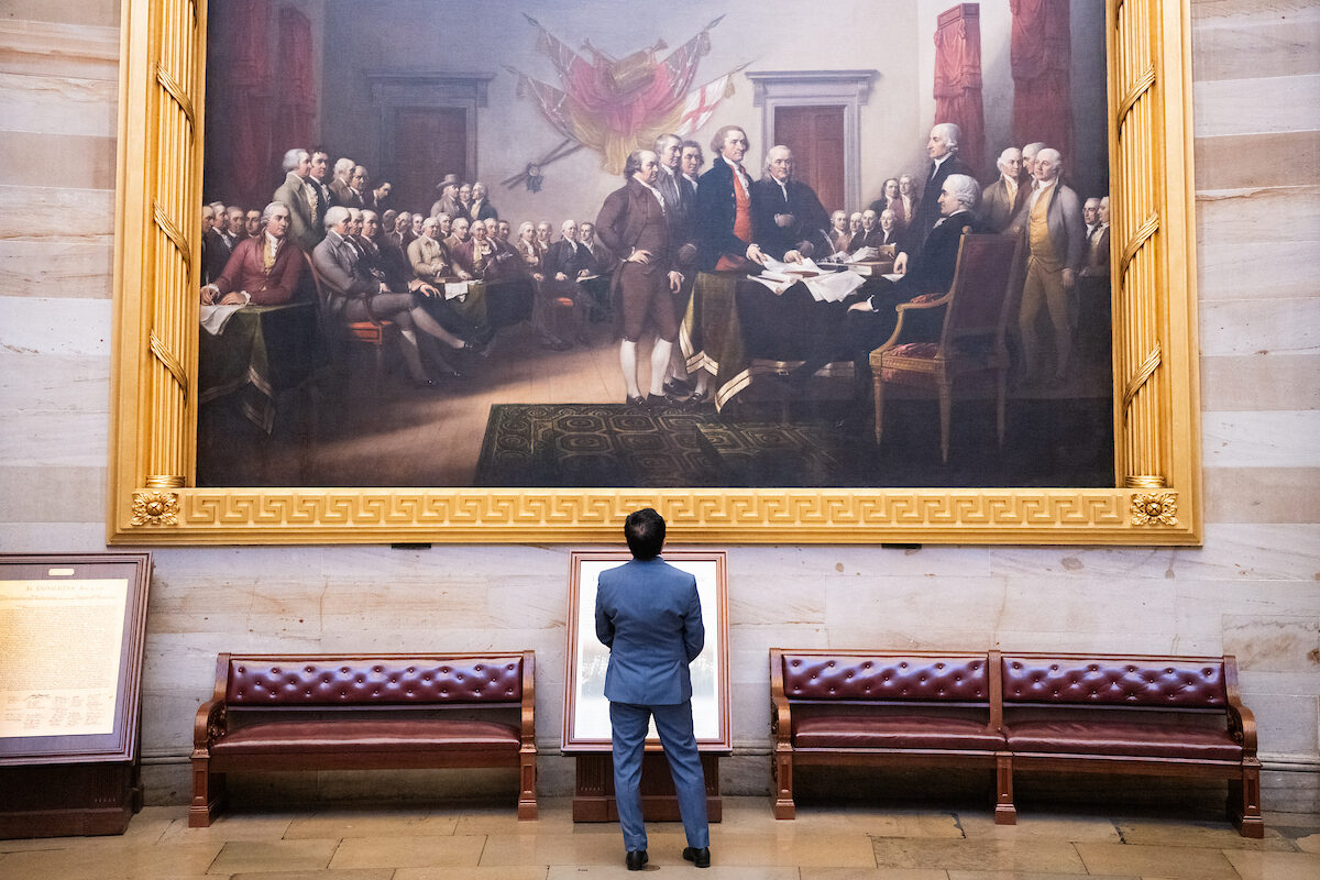 Andy Kim, D-N.J., takes in John Trumbull’s “Declaration of Independence” painting in the Capitol Rotunda before being sworn in to the Senate on Monday.
