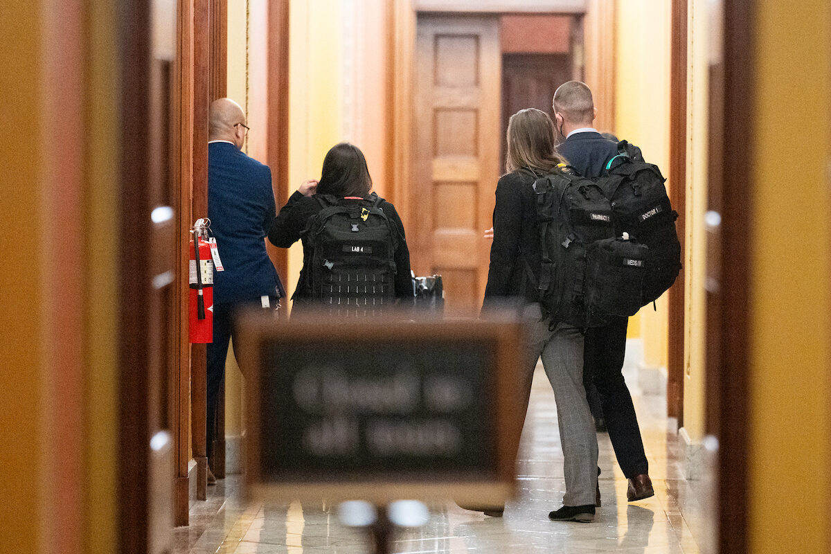 Staff from the Office of the Attending Physician are seen leaving after checking on Senate GOP leader Mitch McConnell in his office in the Capitol. (Bill Clark/CQ Roll Call)