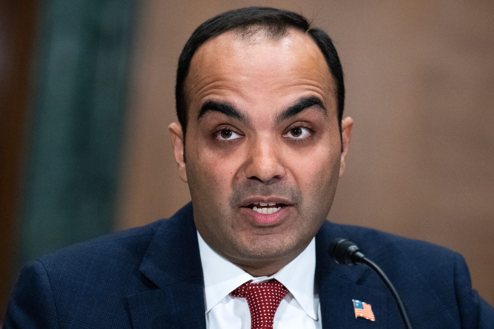 Rohit Chopra, director of the Consumer Financial Protection Bureau, testifies during a Senate Banking, Housing and Urban Affairs Committee hearing on Dec. 11.