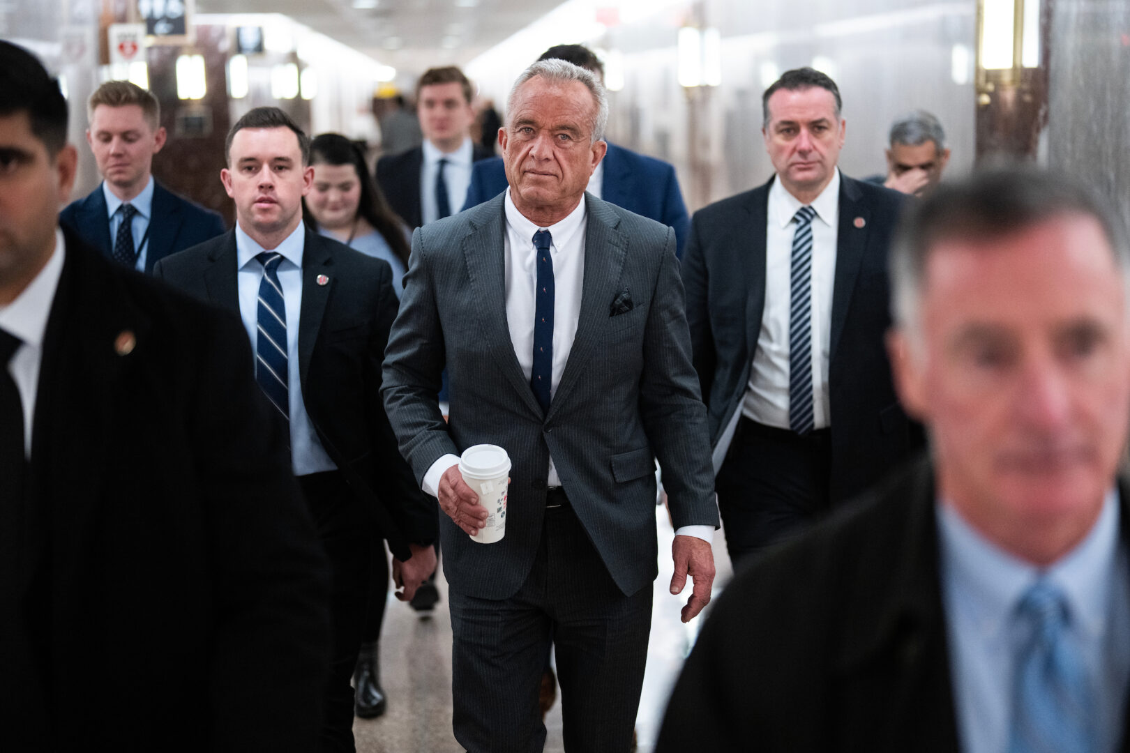 Robert F. Kennedy Jr., President-elect Donald Trump’s pick to be secretary of Health and Human Services, makes his way to a meeting with Sen. Bernie Sanders in the Dirksen Building on Wednesday.