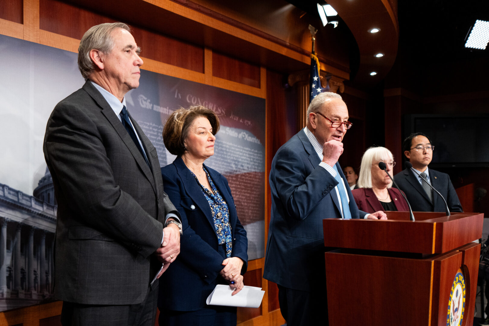 Senate Minority Leader Charles E. Schumer, center, speaks during Senate Democrats’ news conference Tuesday on the Trump administration’s spending freeze on federal assistance. Also seen are, from left, Sens. Jeff Merkley of Oregon, Amy Klobuchar, of Minnesota, Patty Murray of Washington and Andy Kim of New Jersey.