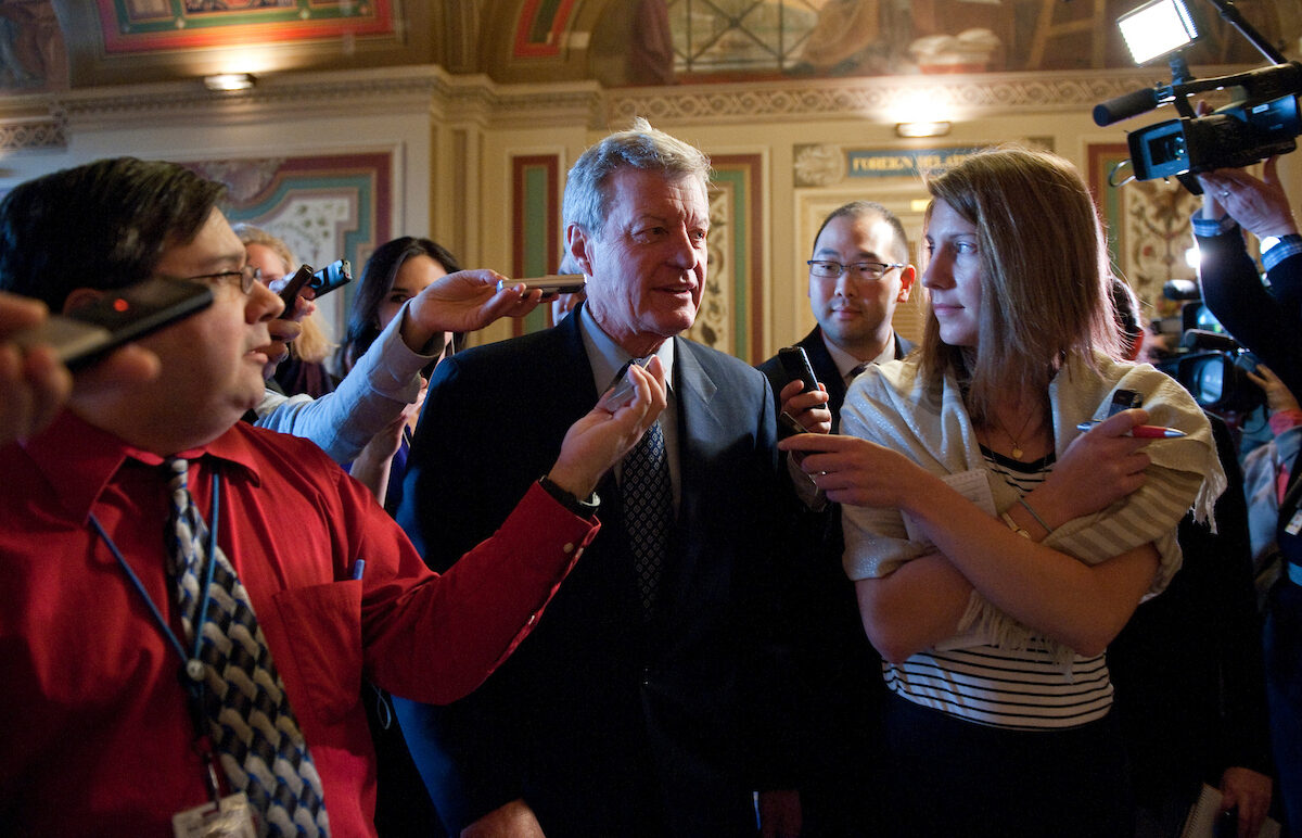 Sen. Max Baucus is questioned by reporters outside the Senate Foreign Relations room in the Capitol, where members of the Joint Select Committee on Deficit Reduction, also know as the “super committee,” were holding a meeting on Nov. 17, 2011.
