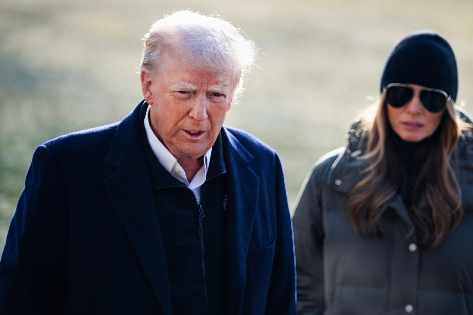President Donald Trump and first lady Melania Trump speak to reporters on the South Lawn of the White House before boarding Marine One en route to North Carolina and California on Friday, Jan. 24, 2025. 