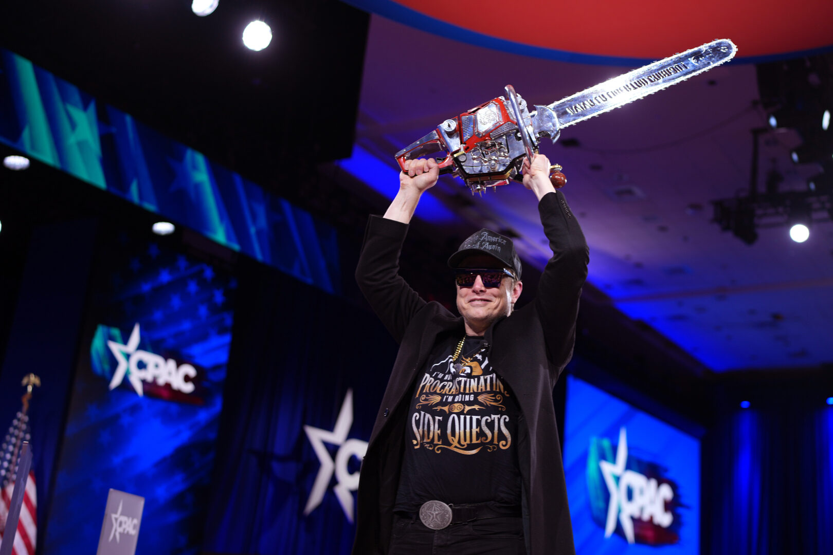 CEO of Tesla and SpaceX Elon Musk leaves the stage holding a chainsaw after speaking at the Conservative Political Action Conference (CPAC) at the Gaylord National Resort Hotel And Convention Center on Thursday. 