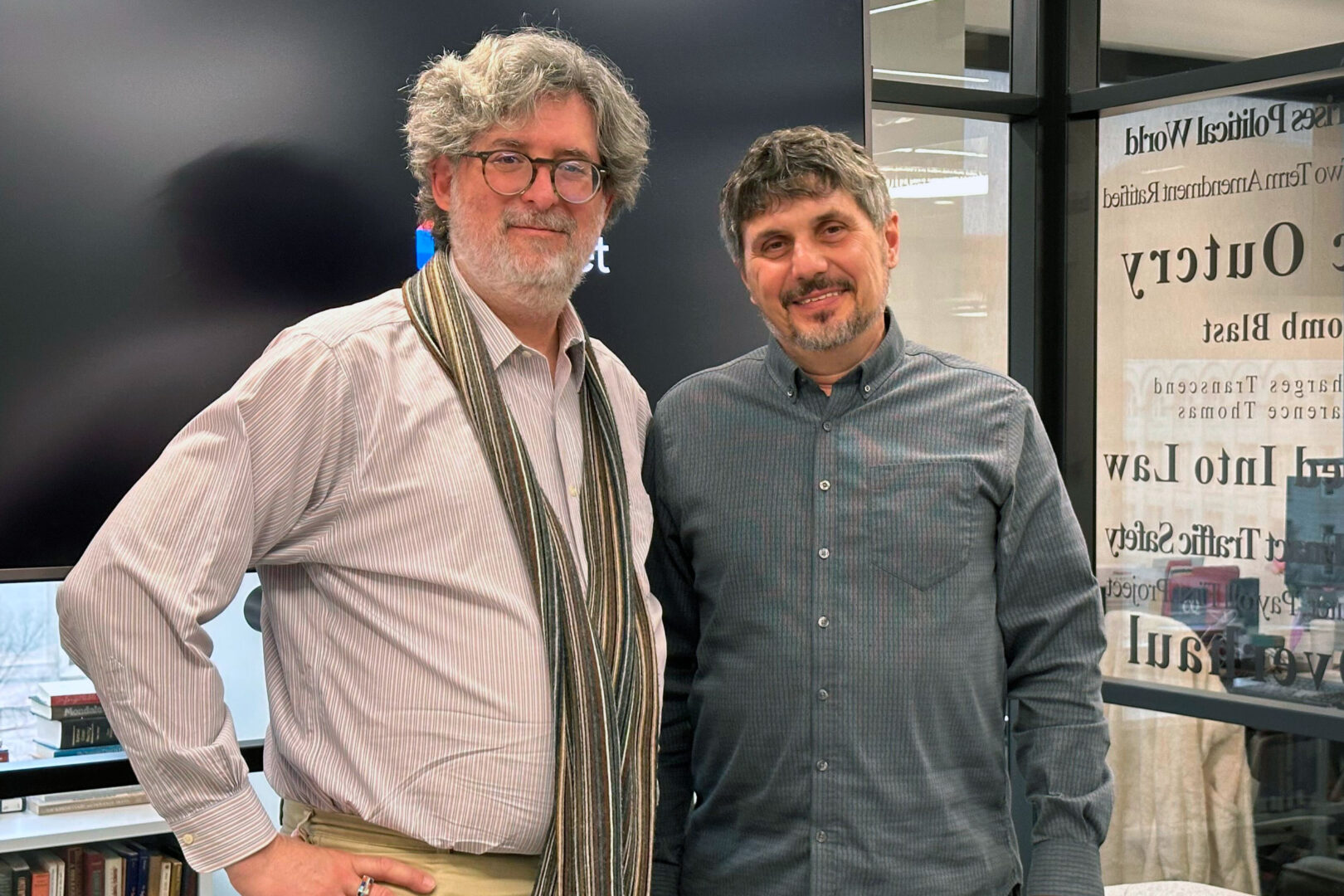 Political Theater podcast host Jason Dick and “Porcelain War” co-director Slava Leontyev in the Roll Call newsroom.