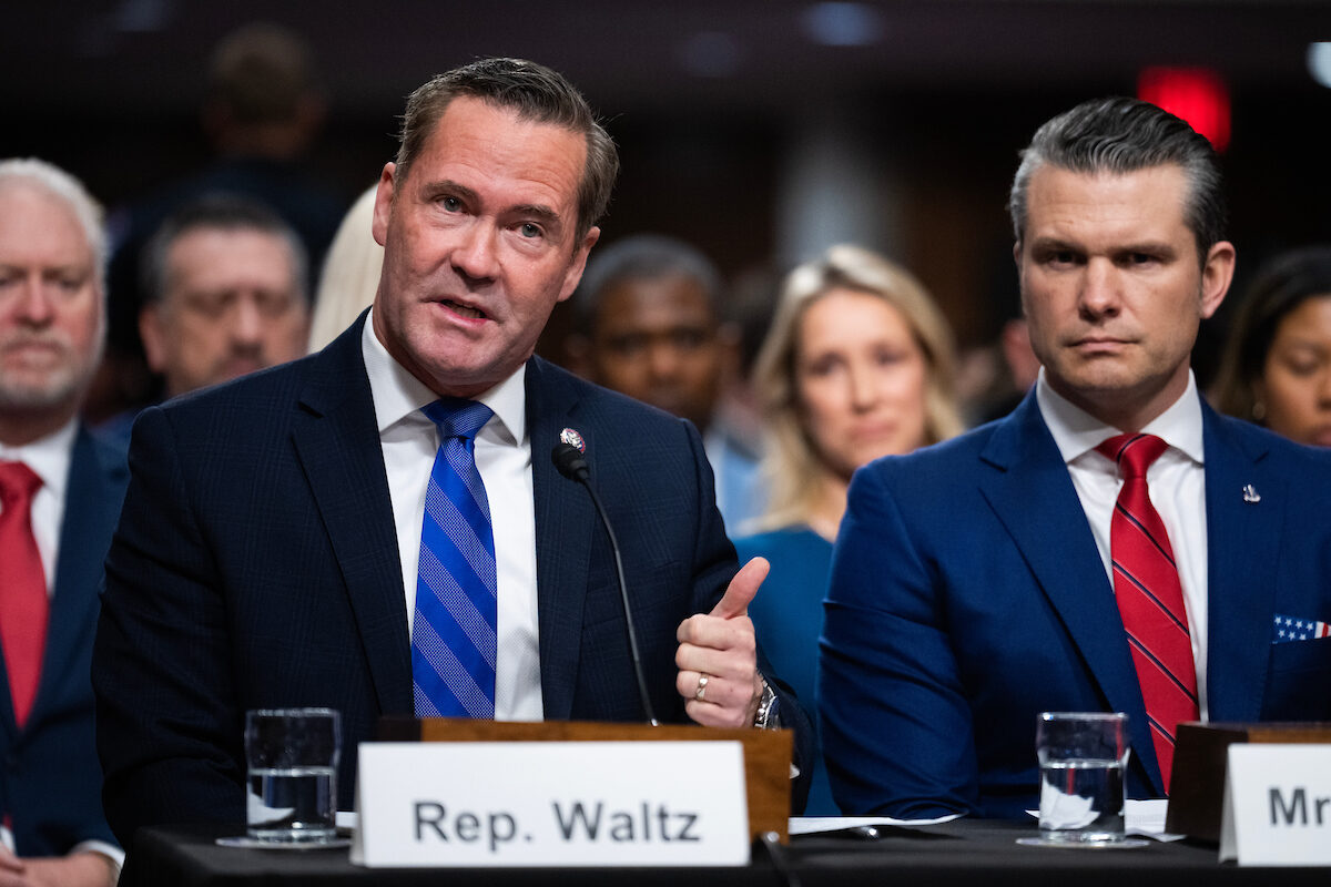 National security adviser Michael Waltz and Defense Secretary Pete Hegseth are pictured during Hegseth's confirmation hearing last month.