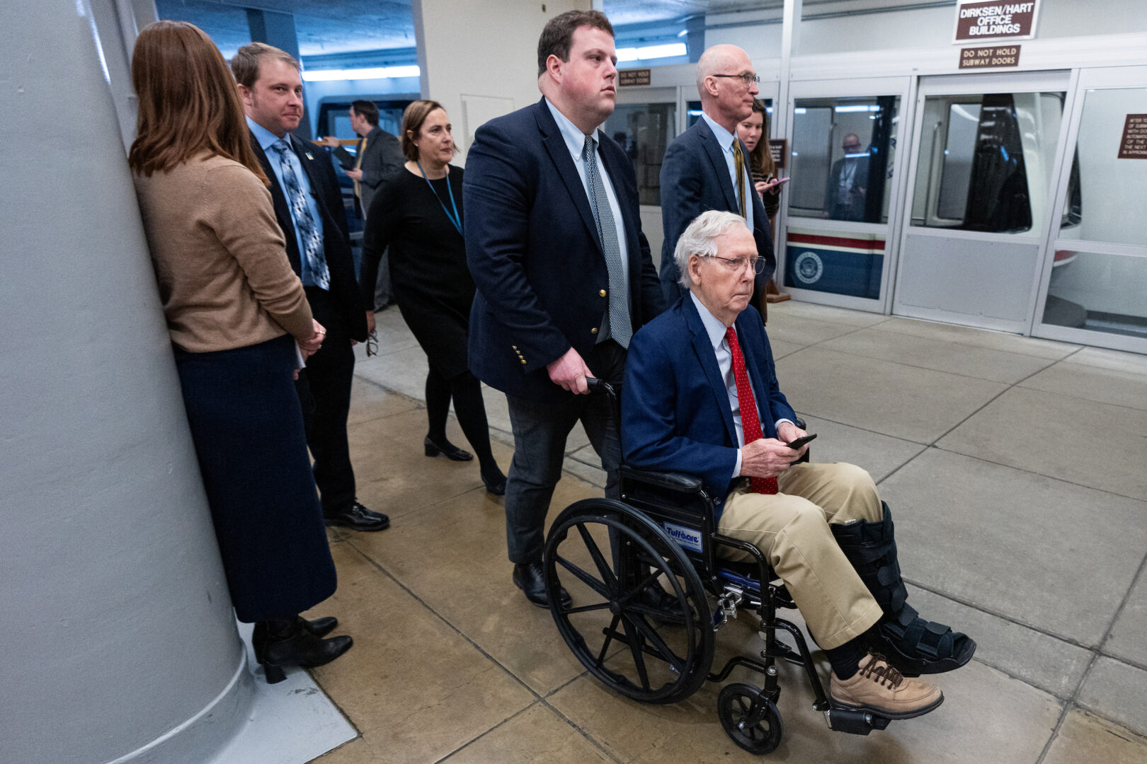 Sen. Mitch McConnell, R-Ky., arrives in his wheelchair for the cloture vote on FBI nominee Kash Patel on Thursday. McConnell has been the strongest GOP opponent of President Donald Trump's shifts in Russia policy. 