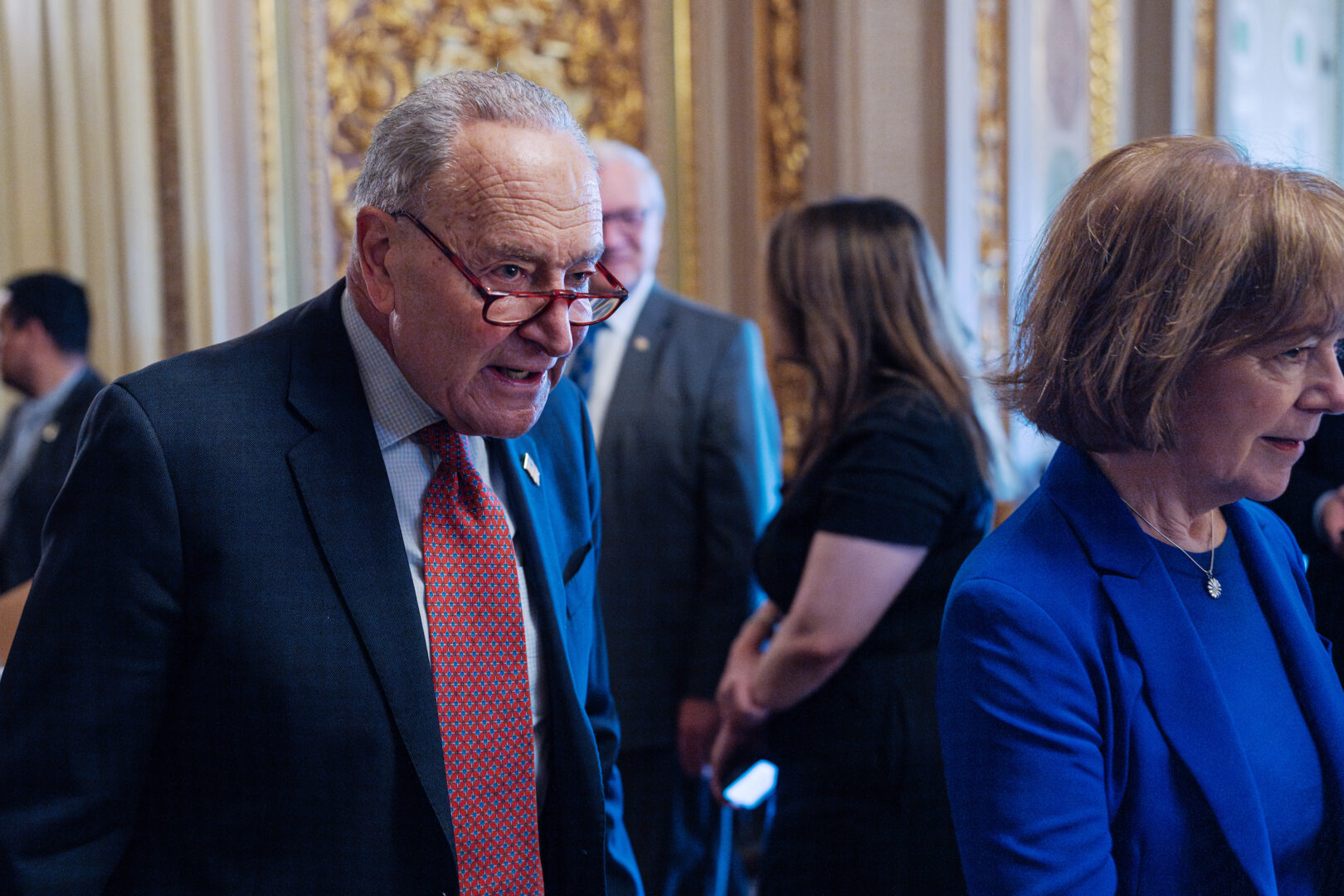 Senate Minority Leader Charles E. Schumer, D-N.Y., and Sen. Tina Smith, D-Minn., arrive for Senate Democrats’ lunch meeting in the Capitol on Thursday. 