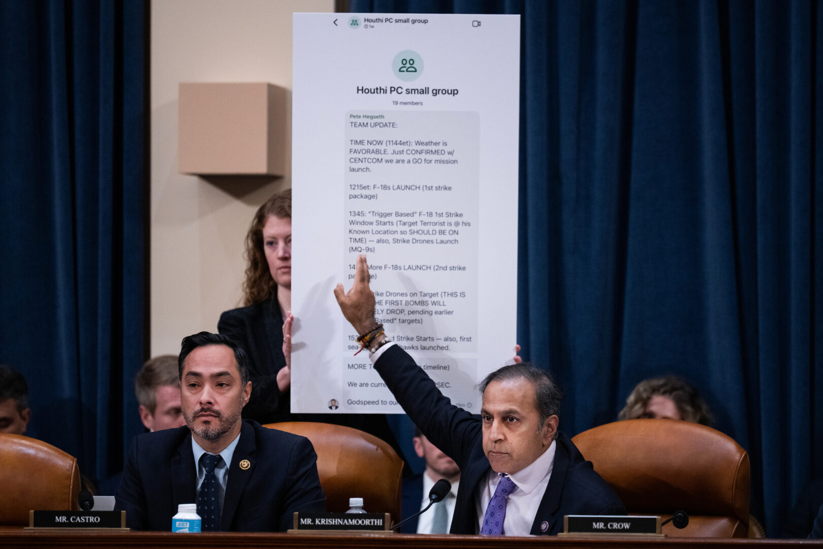 Rep. Raja Krishnamoorthi, D-Ill., references a copy of the Signal chat about attacks against Houthis in Yemen that included a reporter, while questioning witnesses during the House Select Intelligence Committee hearing on Wednesday.