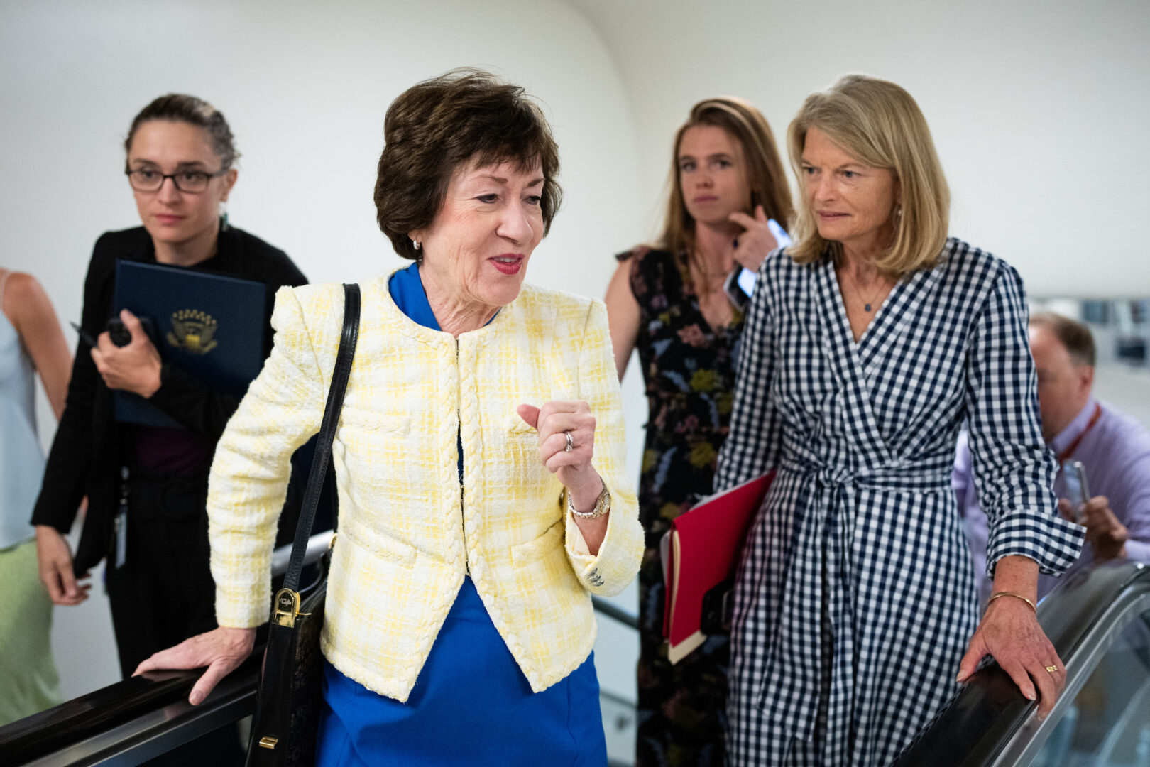 From left, Sen. Susan Collins, R-Maine, and Sen. Lisa Murkowski, R-Alaska, talk as they arrive for a vote in the Capitol on Wednesday. (Bill Clark/CQ Roll Call)