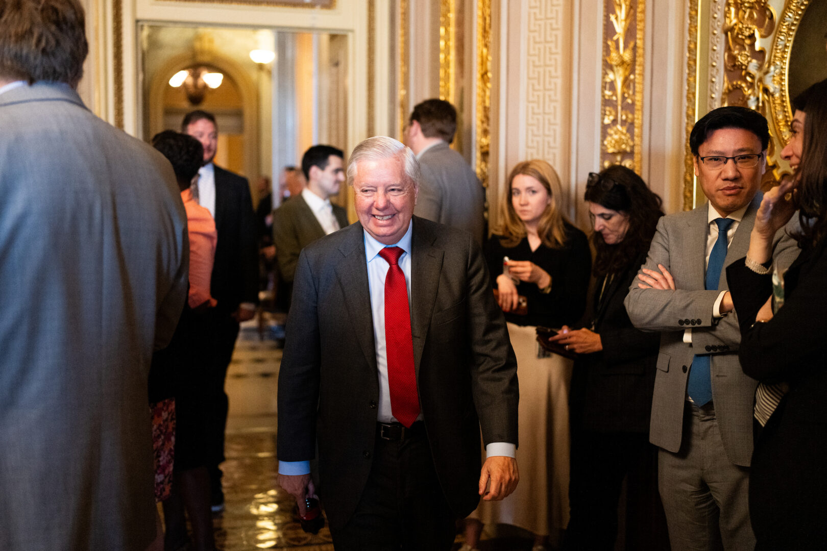 Sen. Lindsey Graham, R-S.C., walks through the Senate Reception Room in the Capitol on March 11. 