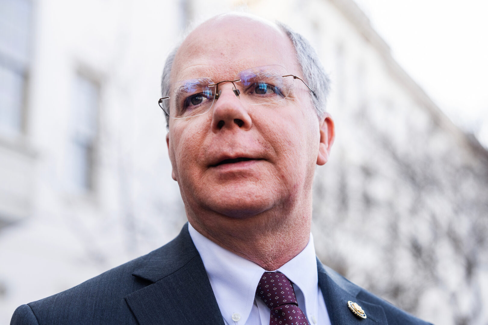 Rep. Brett Guthrie, R-Ky., talks with reporters outside the Capitol Hill Club after a meeting of the House Republican Conference on March 4.