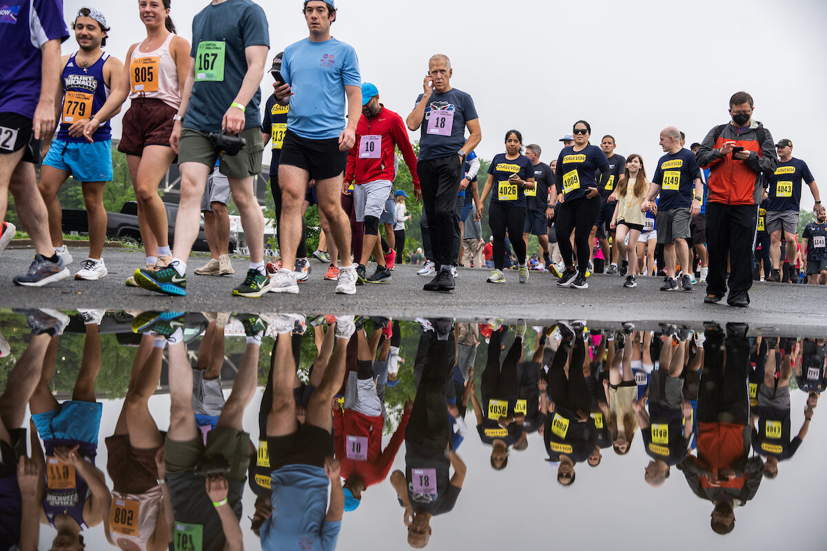 Runners make their way to the starting line of the ACLI Capital Challenge 3-mile race in Anacostia Park on Wednesday.