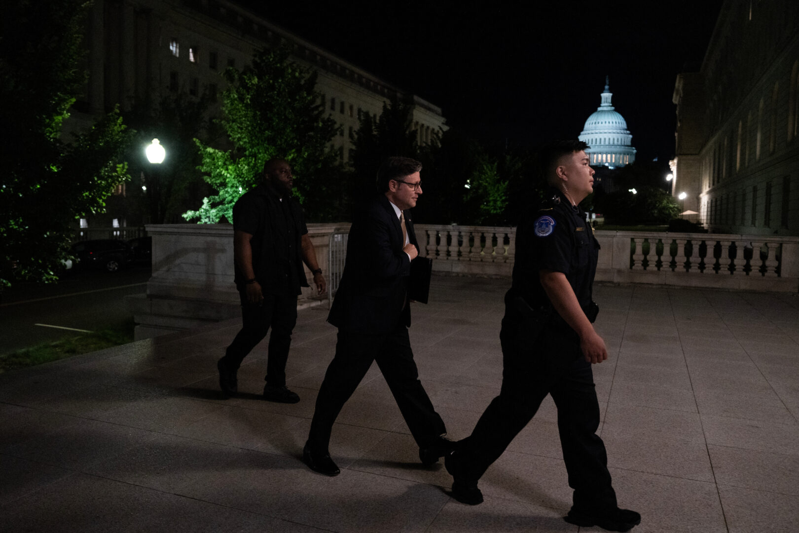 Speaker Mike Johnson, R-La., arrives at the Cannon House Office Building to meet with Republican members of the House Budget Committee before a markup Sunday. 