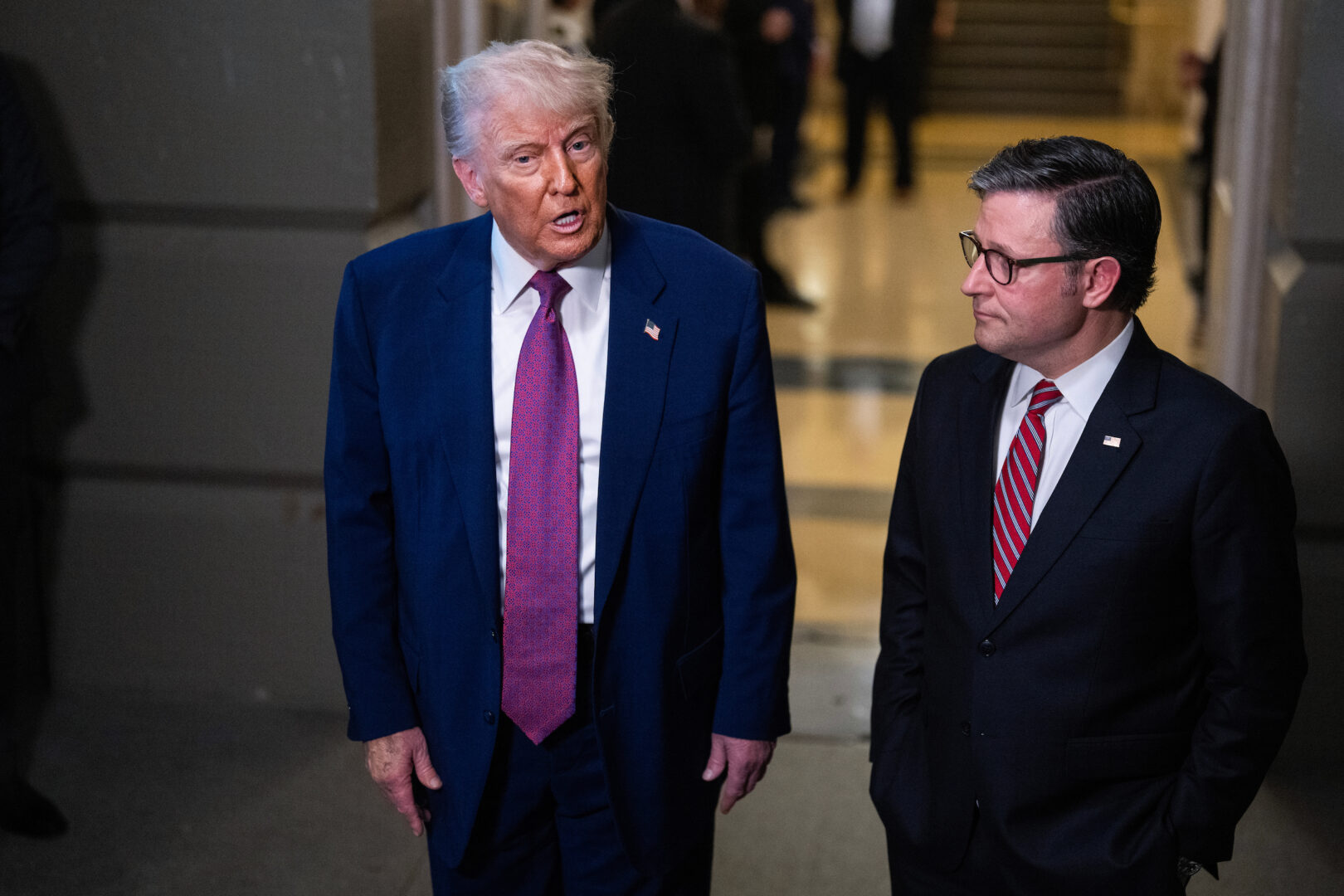 President Donald Trump and Speaker Mike Johnson, R-La., talk with reporters after a House Republican meeting in the Capitol on May 20. (Tom Williams/CQ Roll Call)