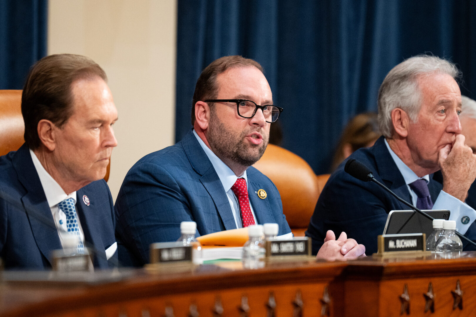 Chairman Jason Smith, R-Mo., center, opens the House Ways and Means Committee markup of the budget reconciliation bill on Tuesday. Smith is flanked by Rep. Vern Buchanan, R-Fla., left, and ranking member Richard E. Neal, D-Mass.