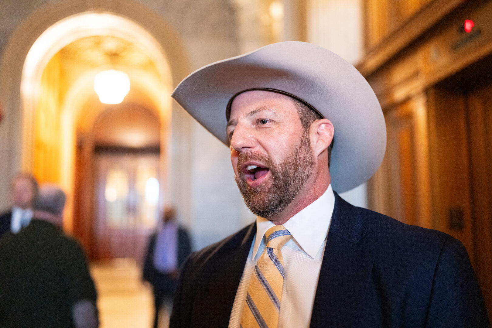 Sen. Markwayne Mullin, R-Okla., speaks to reporters as he leaves the Senate floor in the U.S. Capitol on Thursday, March 13, 2025. 
