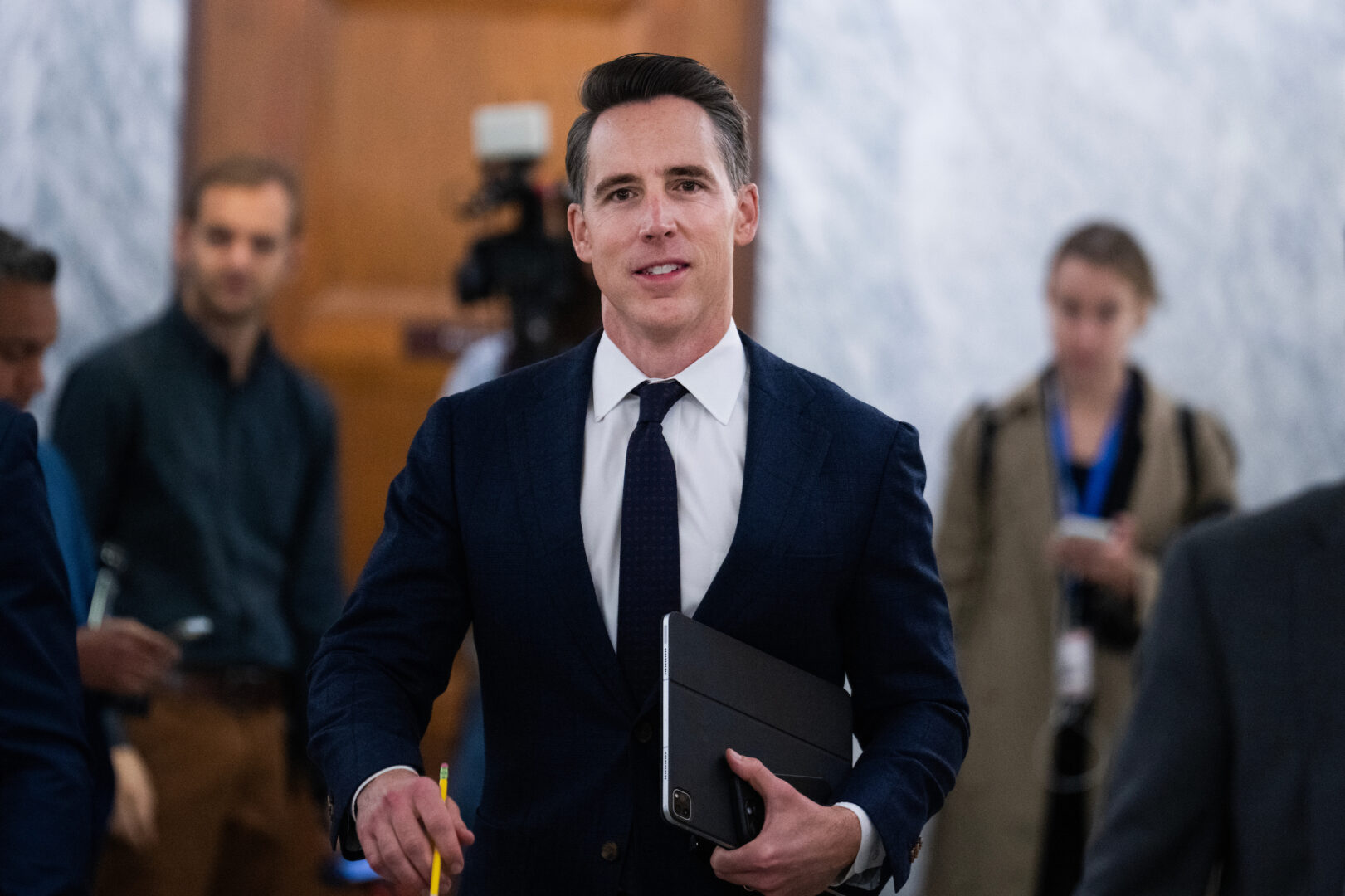 Sen. Josh Hawley, R-Mo., makes his way to a Senate Judiciary Committee confirmation hearing in the Dirksen Senate Office Building.