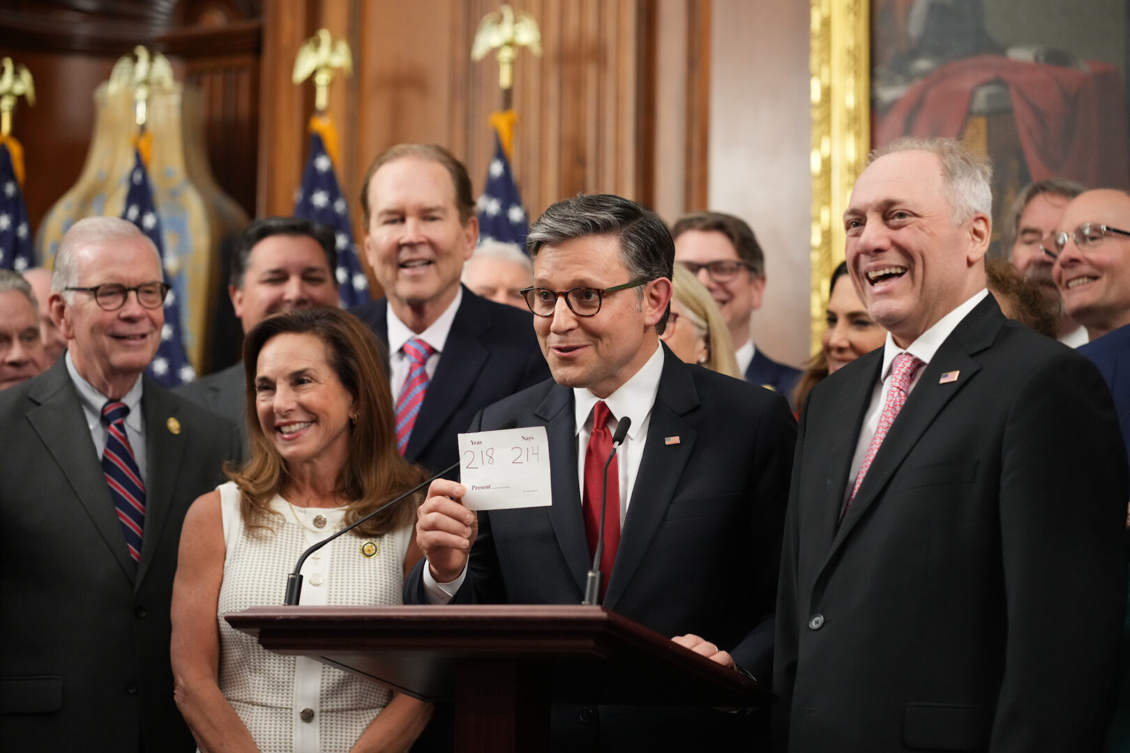 Speaker Mike Johnson holds up the final vote total on passing President Donald Trump's "big, beautiful" budget reconciliation bill on Thursday.