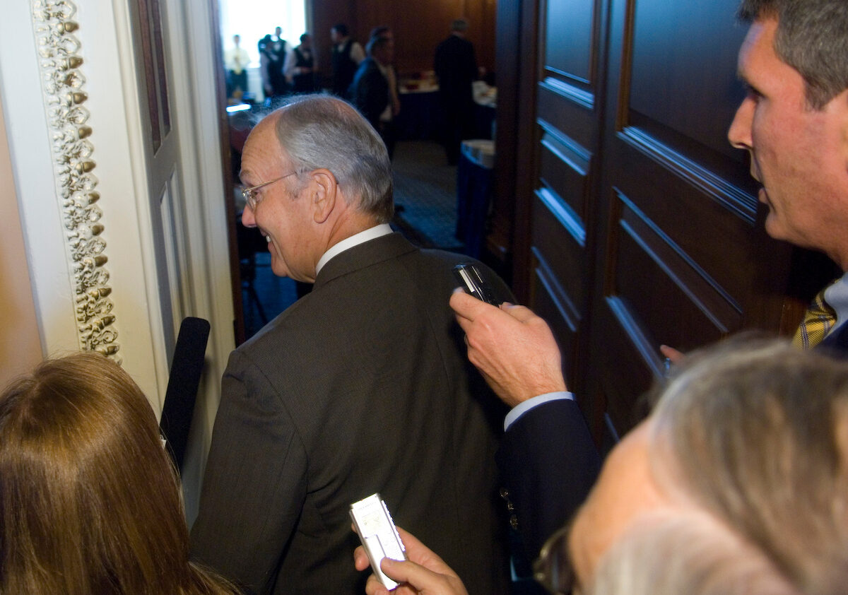 Reporters question then-Idaho Republican Sen. Larry Craig as he headed from the Senate floor to the Republican policy luncheon on Sept. 18, 2007, the day Craig returned to the Capitol for the first time since the disclosure of his guilty plea following a police sting operation in a Minneapolis airport bathroom. John McArdle, currently at C-SPAN, broke the story for Roll Call.