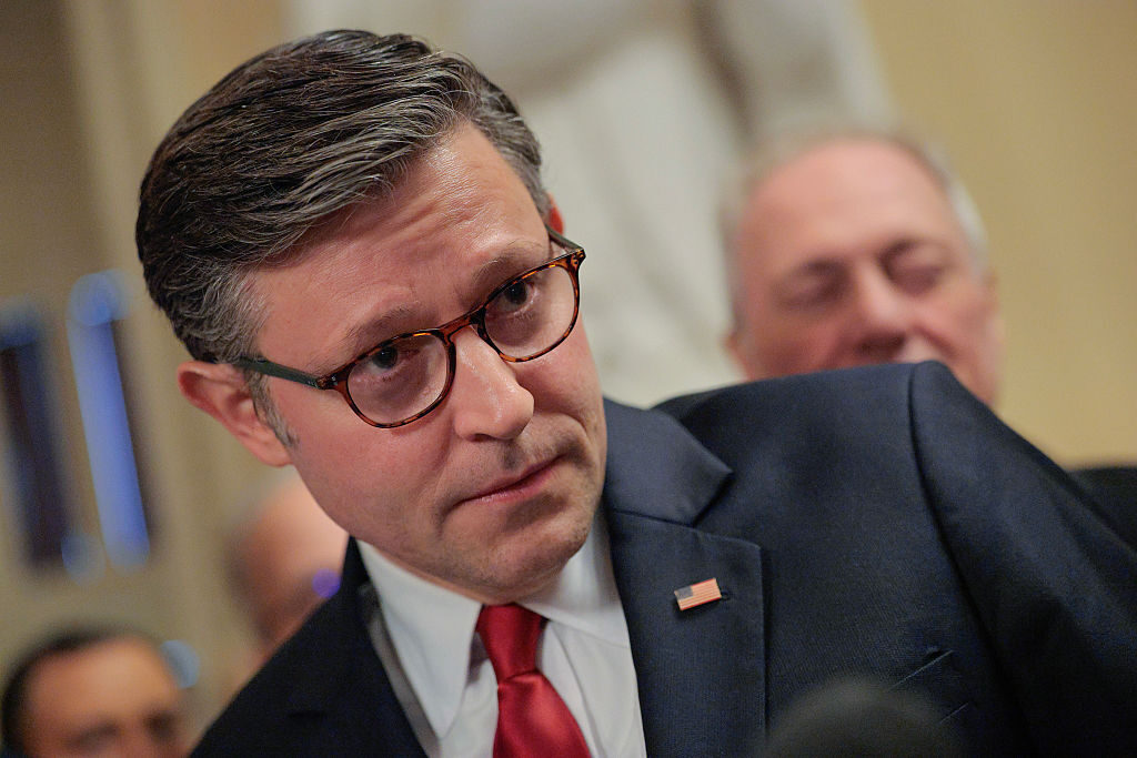 Speaker Mike Johnson, R-La., talks with reporters before heading to the House chamber for a procedural vote on Wednesday.