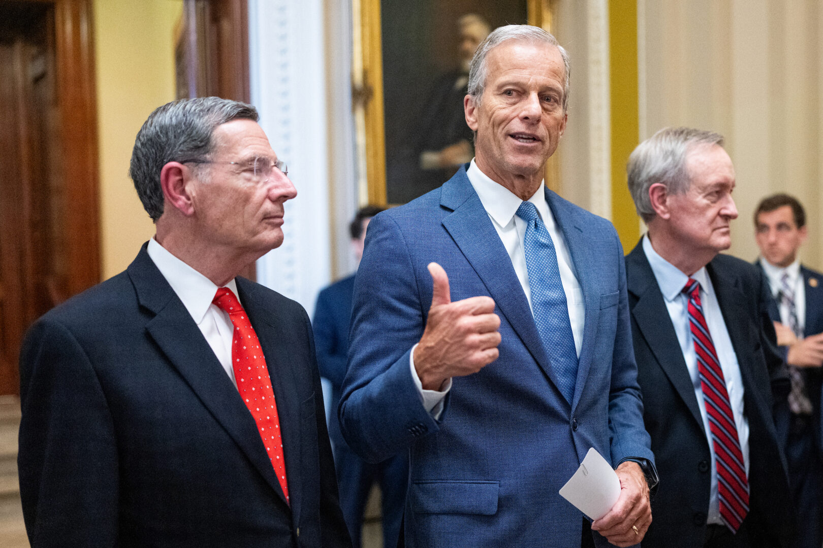 Senate Majority Leader John Thune, flanked by Sens. John Barrasso and Michael D. Crapo, speaks to reporters after the Senate passed the reconciliation package on Tuesday.