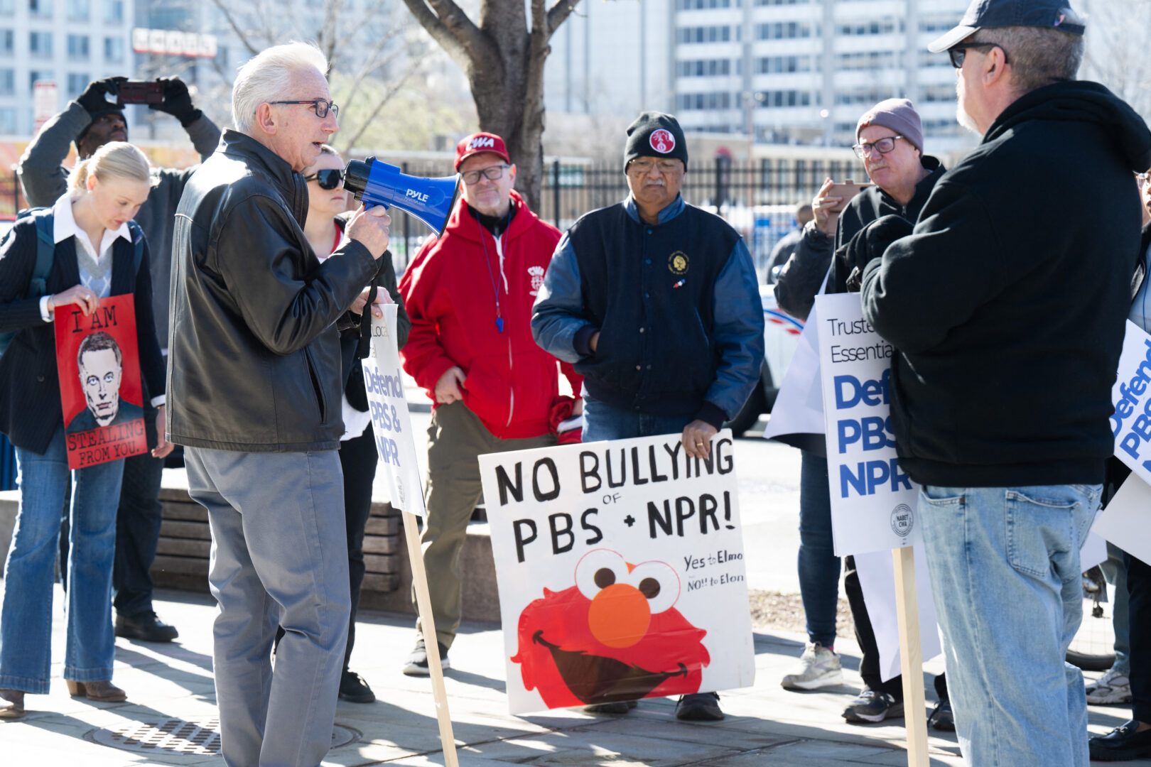 People participate in a rally outside NPR headquarters in Washington on March 26 to call on Congress to protect funding for public broadcasters, the Public Broadcasting Service and National Public Radio.