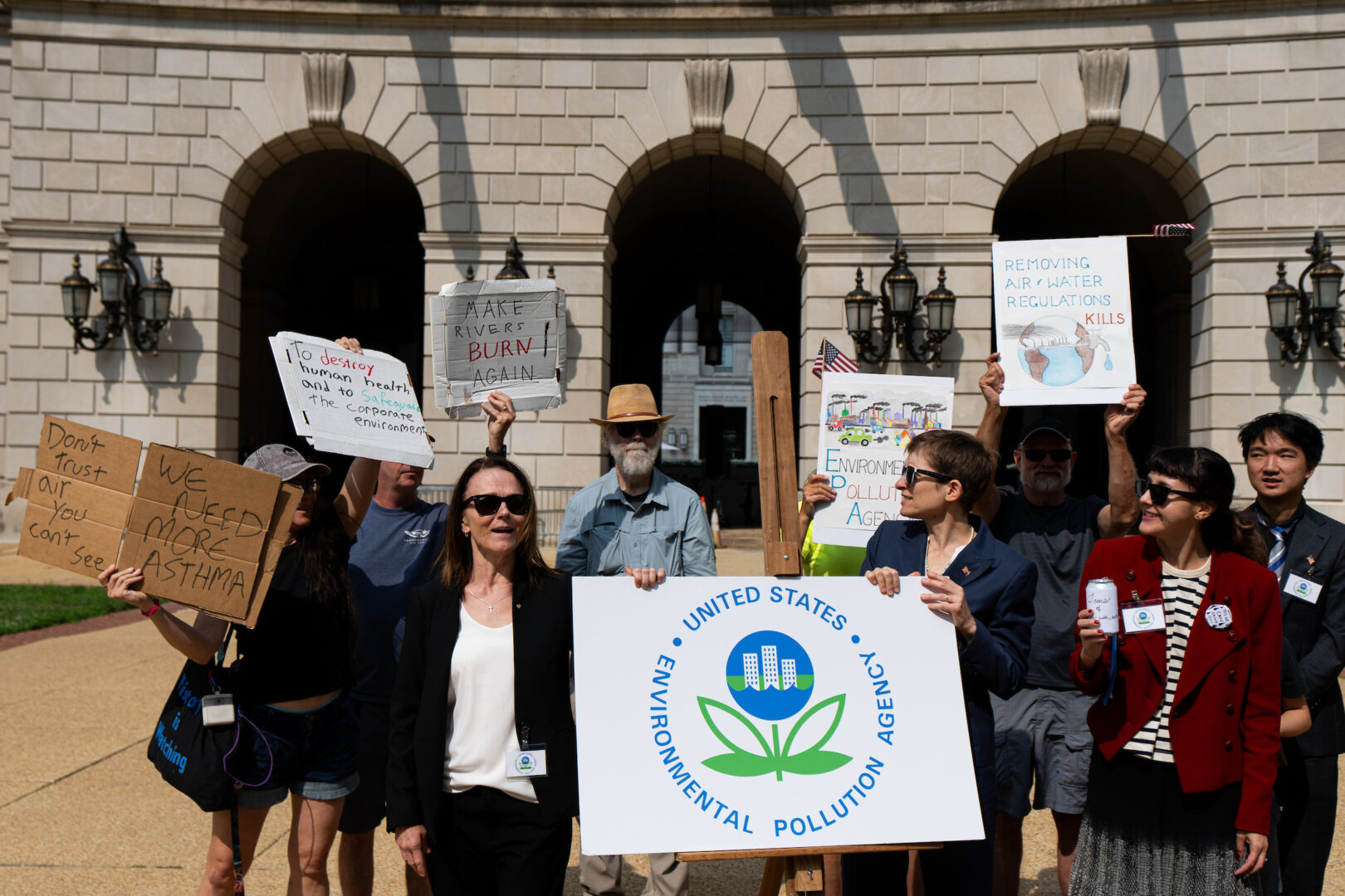 Activists with Shut Down DC hold a protest outside of the EPA headquarters in Washington on Thursday to rename it as the Environmental Pollution Agency.