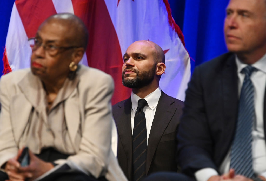 DC Councilmember Robert White, center, stands behind Del. Eleanor Holmes Norton during a ceremony in 2023. Challengers to Norton have started to emerge in earnest as calls mount for her to retire.