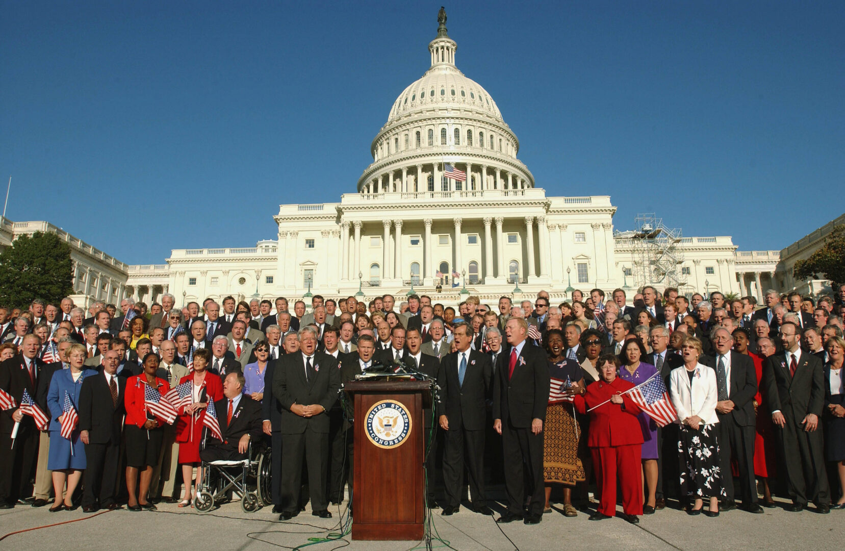 Members of Congress sing “God Bless America” on the Capitol’s West Front on Sept. 11, 2002, one year after the terrorist attacks.