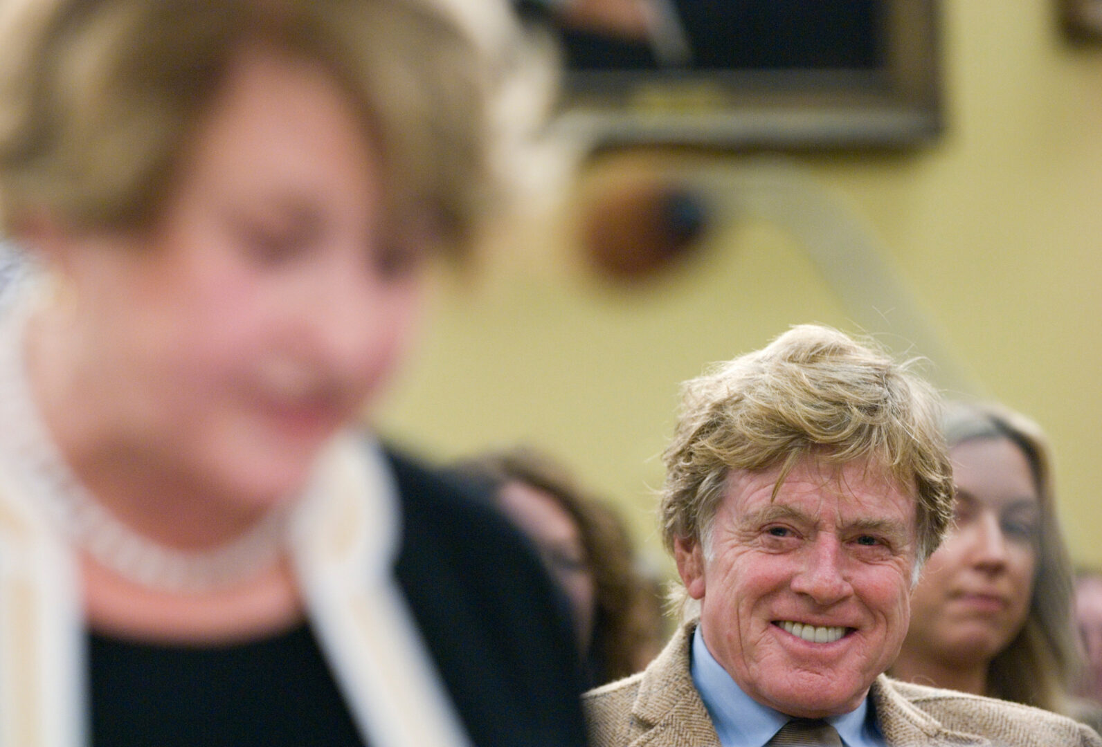Robert Redford is pictured during a House Appropriations  subcommittee hearing in 2008, behind Rep. Louise Slaughter of New York.