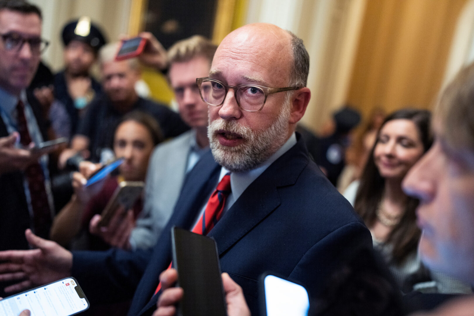 Office of Management and Budget Director Russ Vought talks with reporters in the Capitol on July 15. (Tom Williams/CQ Roll Call)