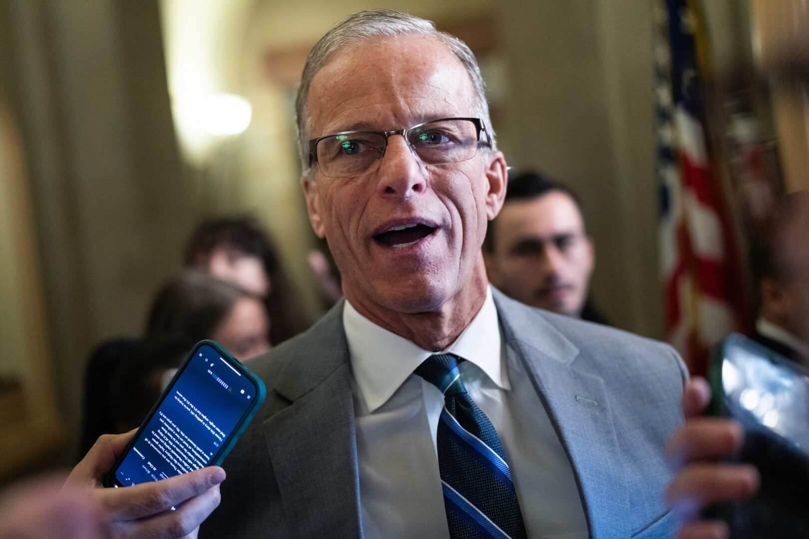 Senate Majority Leader John Thune, R-S.D., talks with reporters in the  Capitol on Oct. 8.
