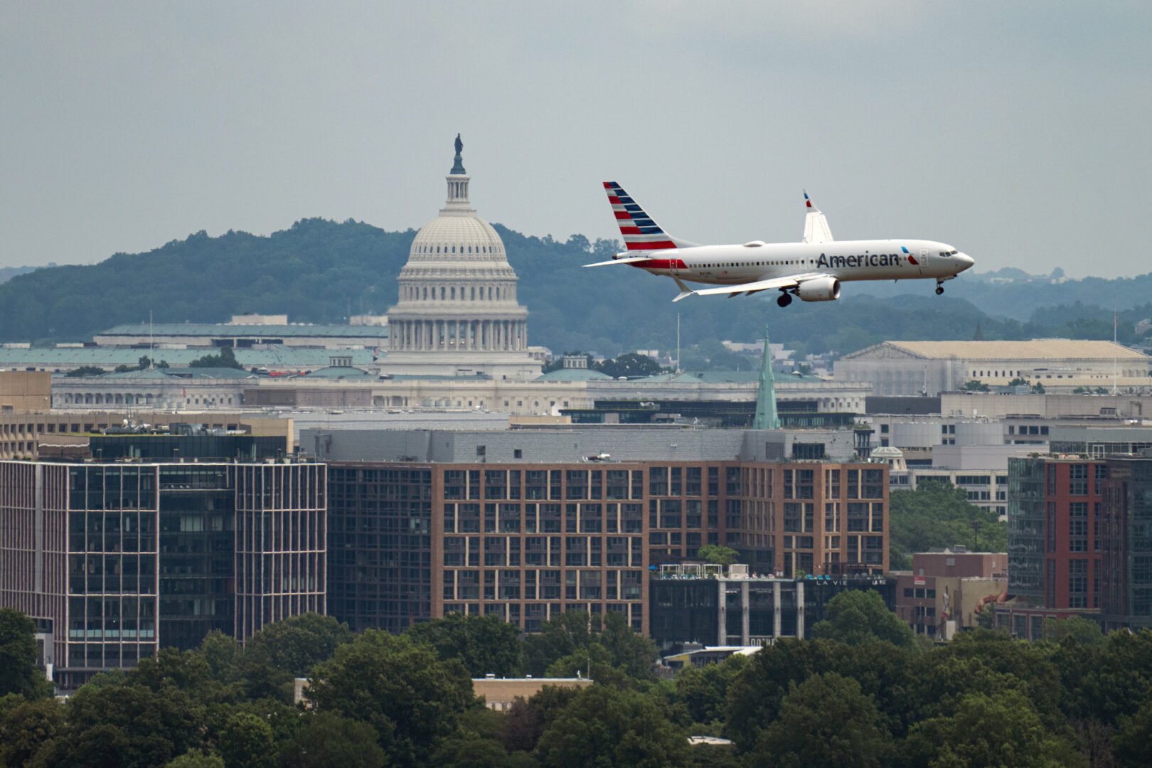 FAA staffing shortages are beginning to cause issues with flight schedules across the country. Above, an American Airlines jet comes in for a landing at Ronald Reagan Washington National Airport on June 14. (Bill Clark/CQ Roll Call)