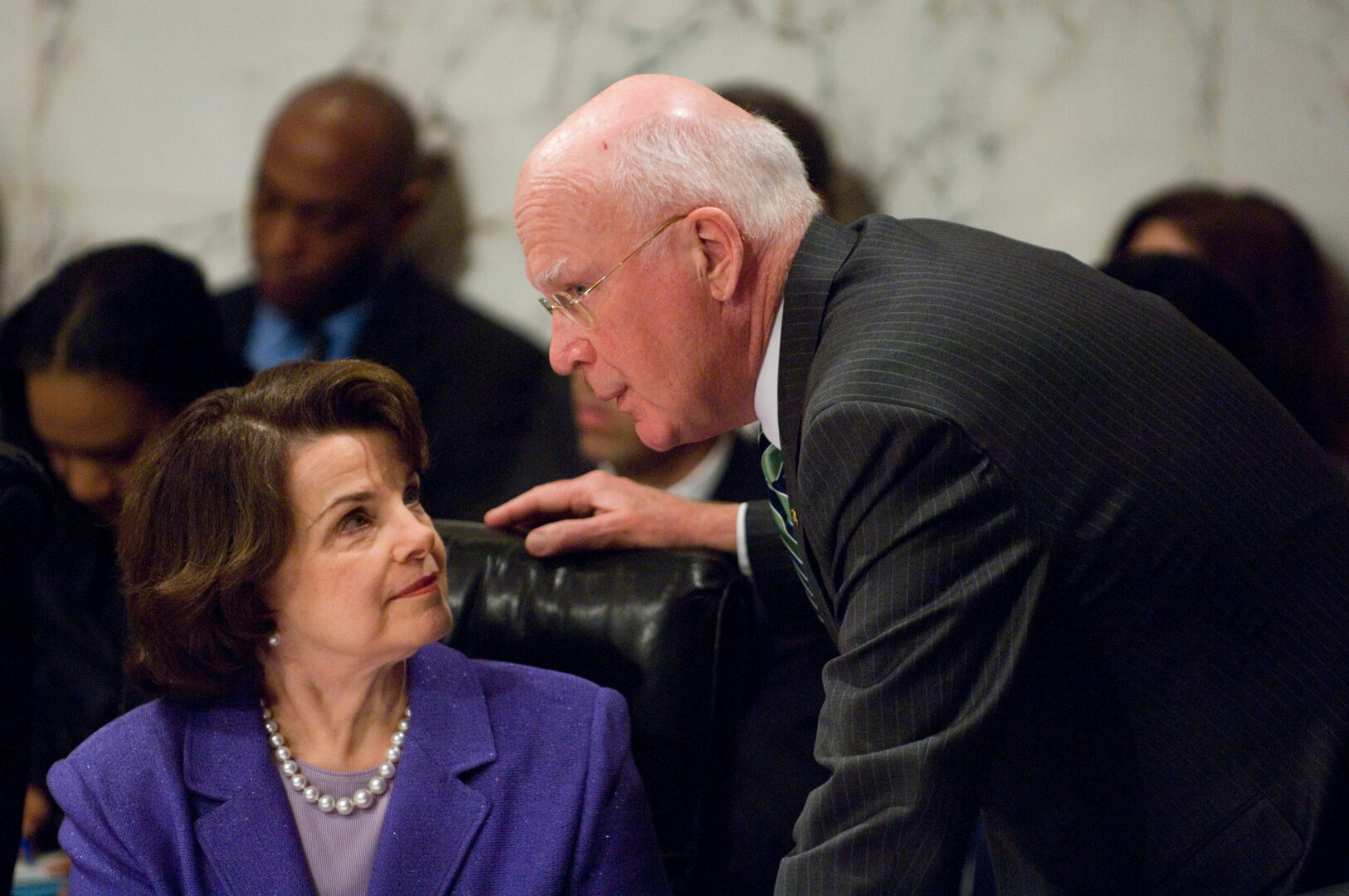 Then-Chairman Patrick J. Leahy speaks with Sen. Dianne Feinstein as Attorney General Alberto Gonzales testifies during a Senate Judiciary Committee hearing in 2007 investigating the firing of several U.S. attorneys.