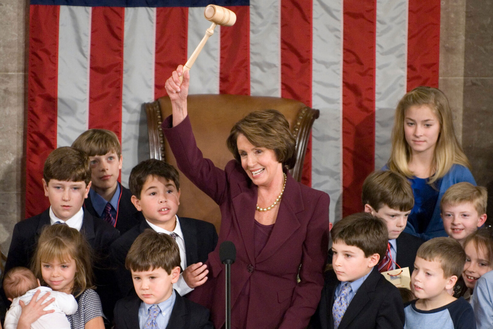 On. Jan. 4, 2007, Speaker Nancy Pelosi wields the gavel on the House floor after being elected to the speakership. Members’ children, including her own grandchildren, join her at the podium. The California Democrat was the first female speaker.