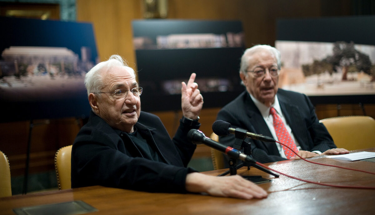 Architect Frank Gehry and Rocco Siciliano, chairman of the Dwight D. Eisenhower Memorial Commission, talk with reporters during a press conference about the memorial for President Eisenhower in the Dirksen Senate Office Building on March 25, 2010.