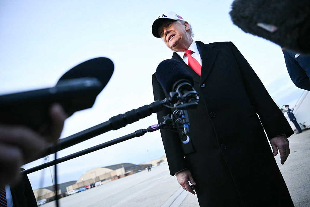 President Donald Trump is marking the upcoming Martin Luther King Jr. holiday by trying to grab attention from a legacy he could only dream of earning, Curtis writes. Above, Trump is seen returning to Joint Base Andrews on Jan. 13.