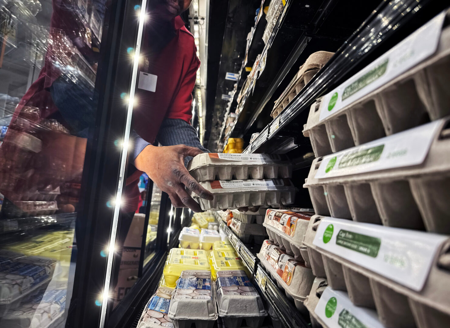 According to David Winston, things have improved since President Trump took office — but  is that enough for people to feel they have the cost of living under control? Above, a worker stocks eggs at a grocery store in D.C. on Feb. 12, 2025. 
